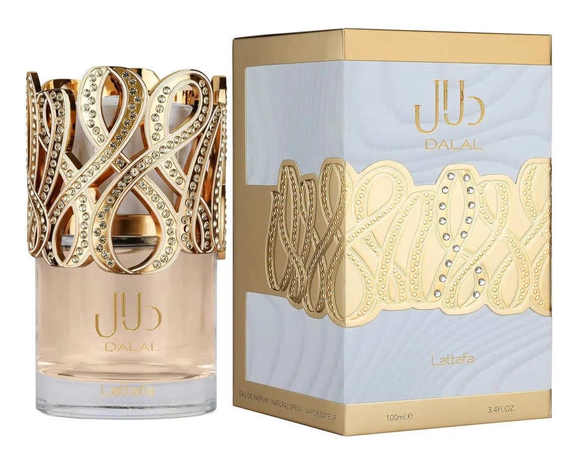 A glass perfume bottle with a decorative gold top and its matching white and gold box.