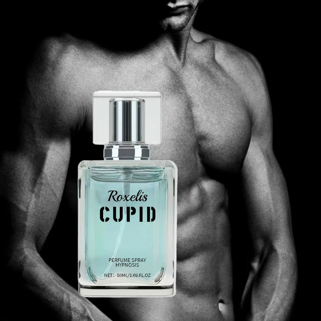 A glass perfume bottle with light blue liquid against a black and white background of a man's torso.