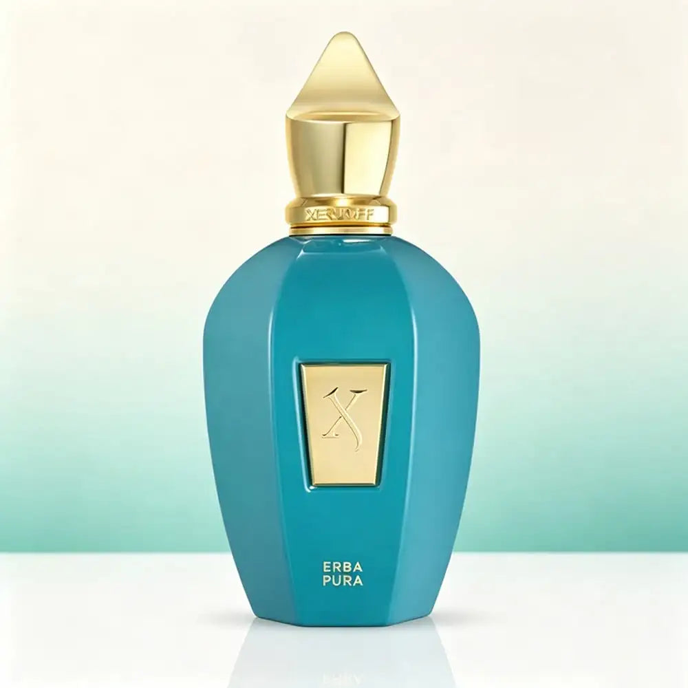 A turquoise glass perfume bottle with a gold stopper, standing on a white surface against a light gradient background.