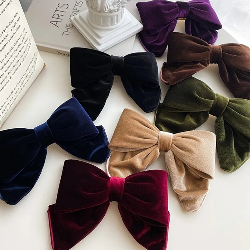Collection of velvet bow hair clips in assorted colors