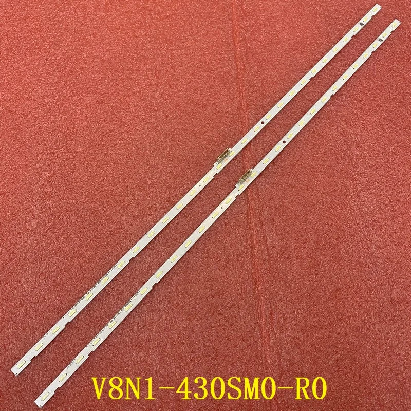 A pair of LED backlight strips with white circuit boards for television repair