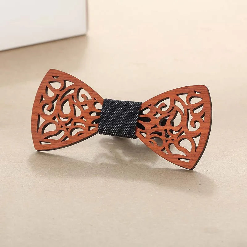 Filigree laser cut wooden bow tie on plain background