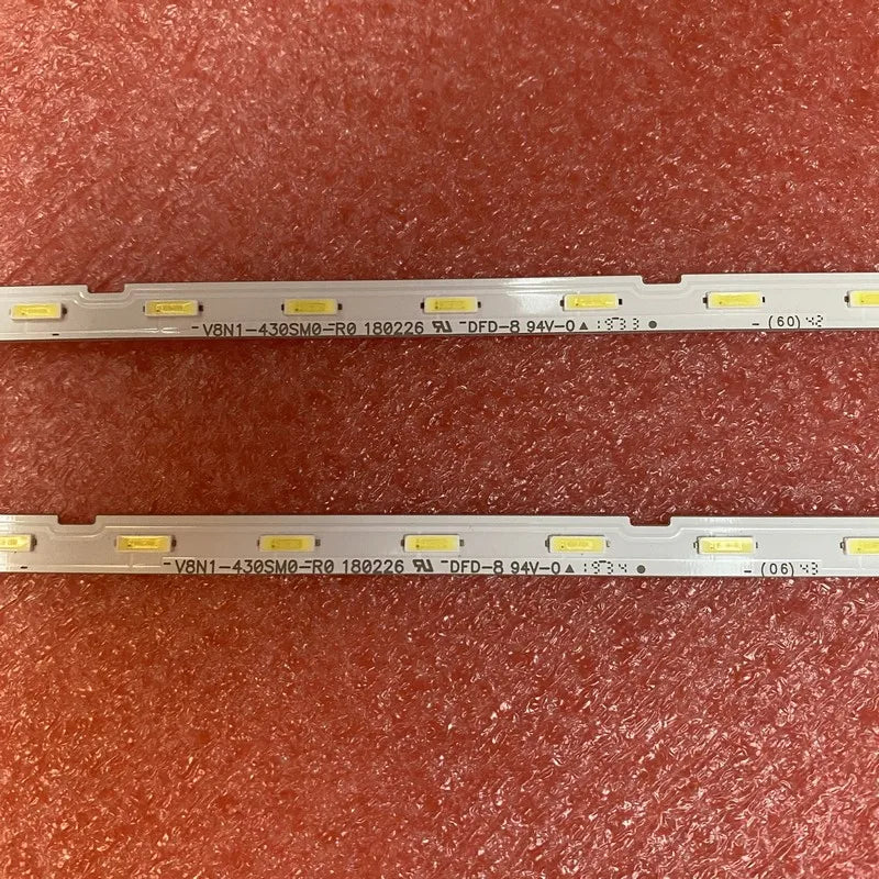 Detailed view of the serial numbers and printed information on two LED backlight strips