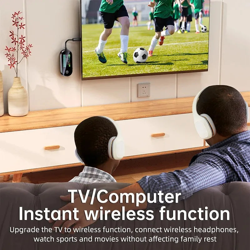Family watching TV with wireless headphones using a Bluetooth audio adapter