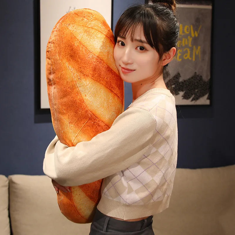 A woman embracing a large, realistic baguette-shaped plush pillow.