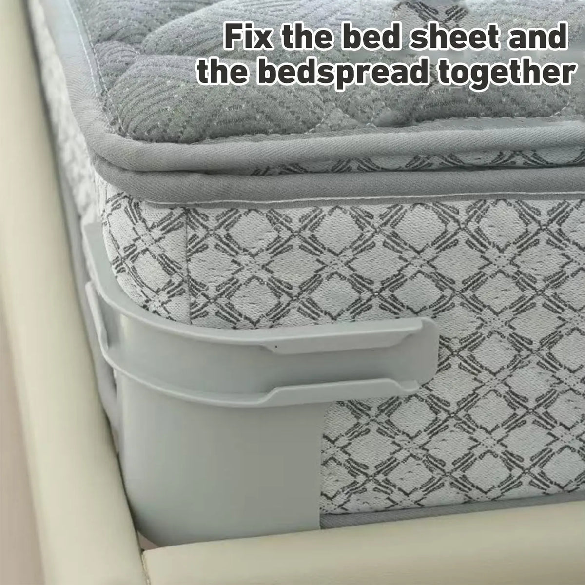 A grey plastic bed sheet corner fastener secured on a bed mattress.