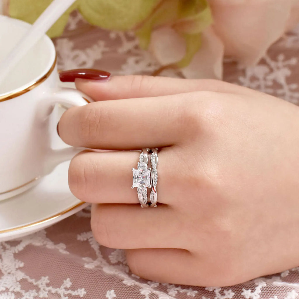 Sterling silver princess cut engagement ring set worn on finger