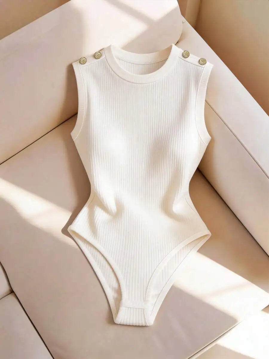 Sleeveless off-white ribbed knit bodysuit with gold decorative buttons on the shoulders