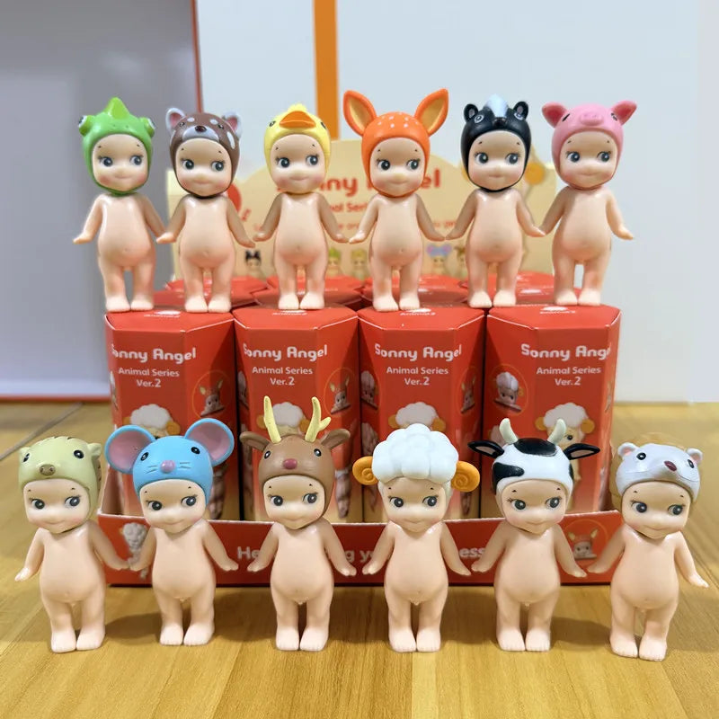 collection of twelve miniature animal-themed figurines standing in front of their orange packaging boxes labeled Animal