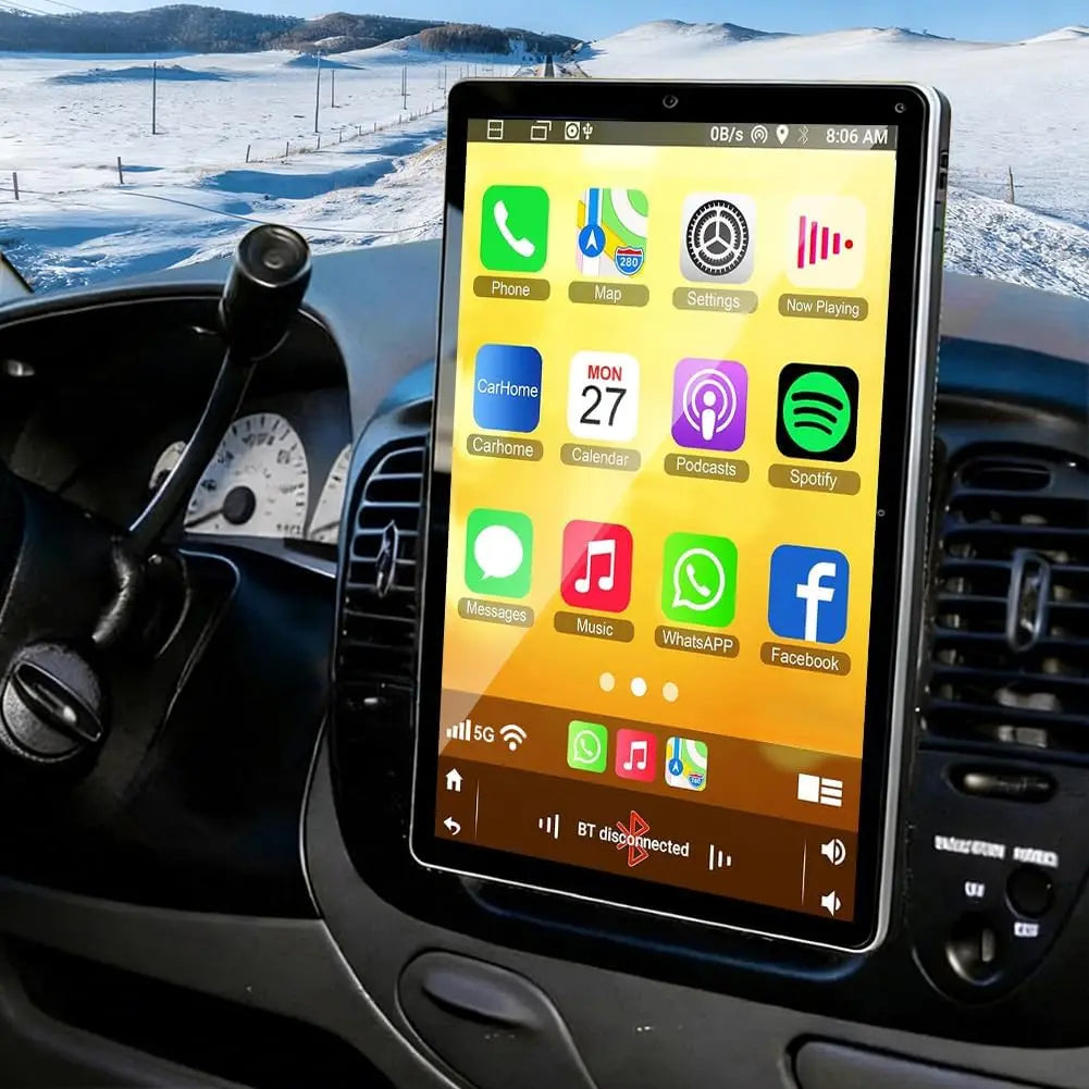 Touch screen car multimedia player installed in a car dashboard showing a snow-covered landscape