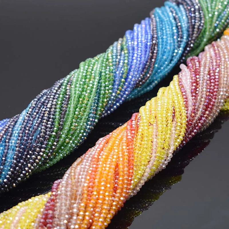 Strands of faceted rondelle crystal glass beads in assorted colors