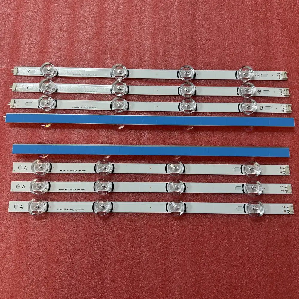 Set of LED backlight strips for TV with blue adhesive backing strips exposed