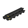 Black plastic trench drain segments with grates for outdoor water drainage