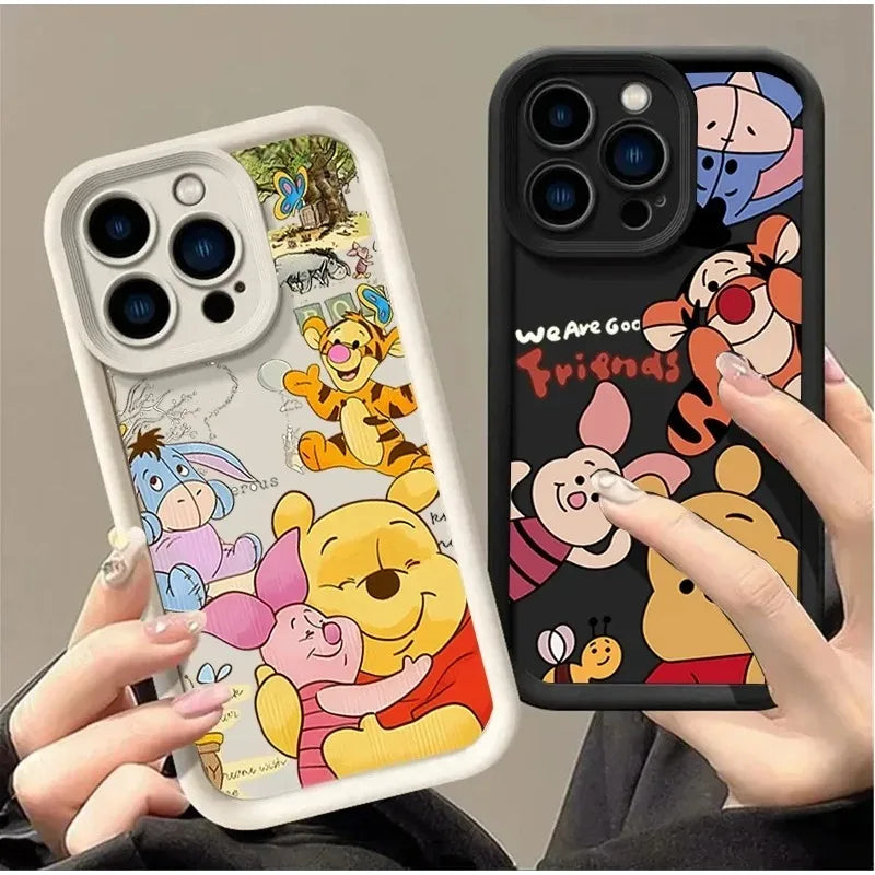 Two phone cases featuring cartoon bear and pig characters on a light and dark background