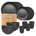 A 12-piece black wheat straw dinnerware set containing plates, bowls, and cups arranged on a table. – 12pc black
