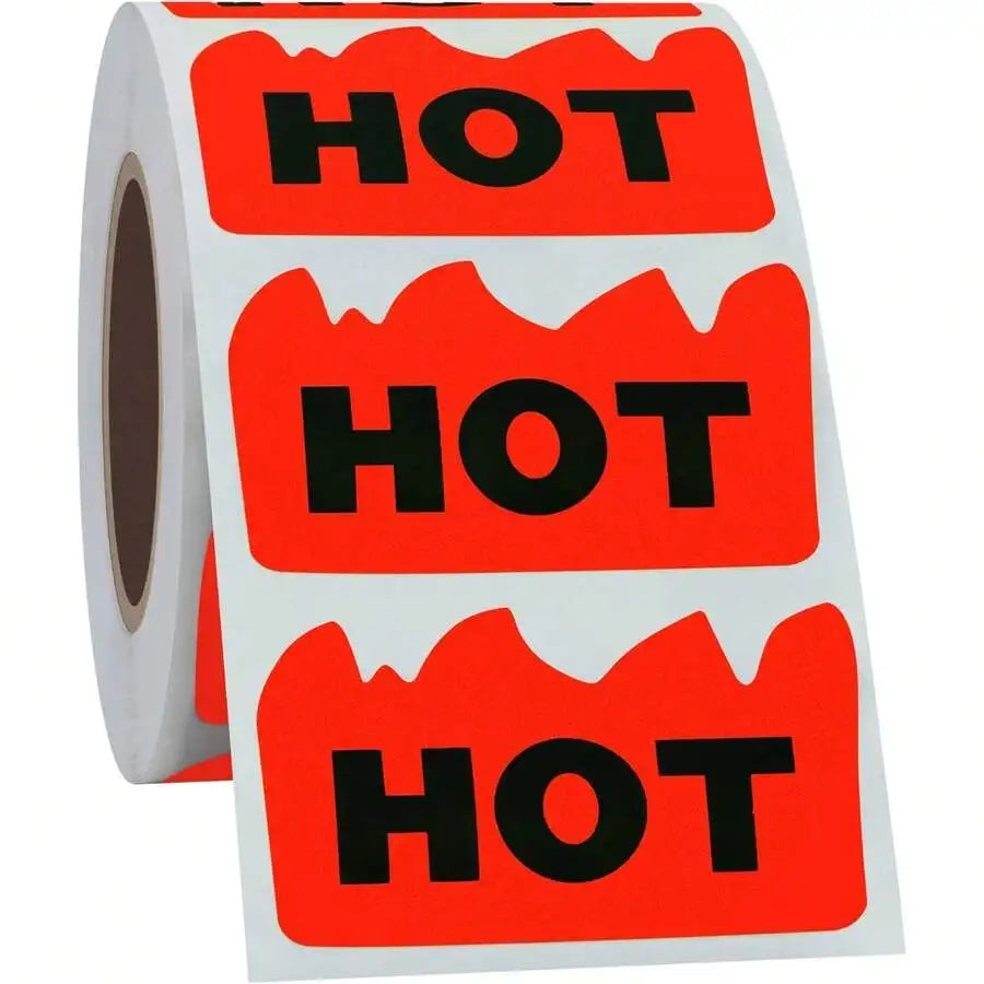 A roll of fluorescent red adhesive labels shaped like flames with the word HOT printed on them