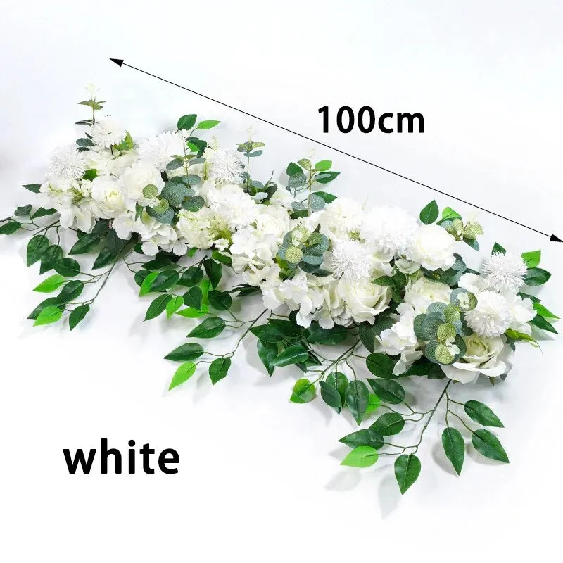 White artificial flower centerpiece row for wedding with measurement markings
