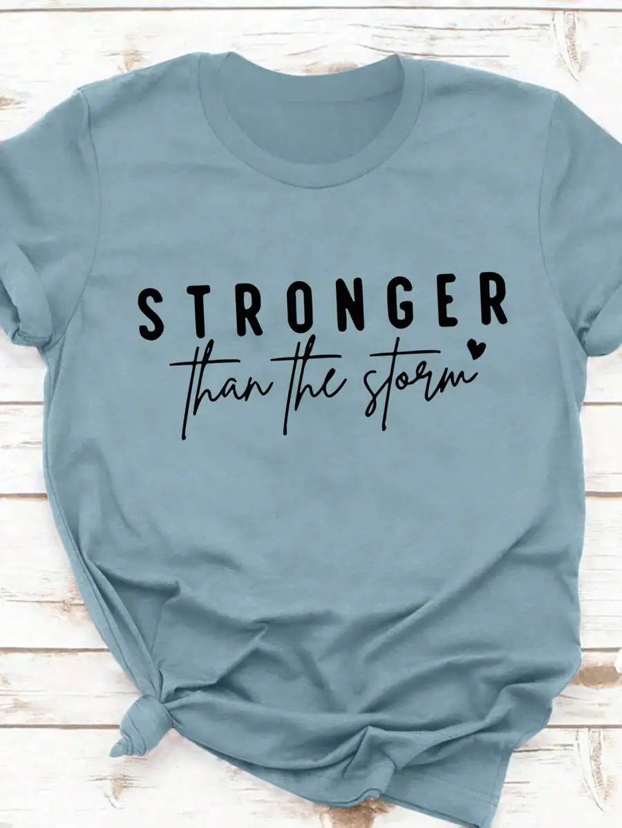 Light blue crew neck t-shirt with inspirational stronger than the storm graphic print