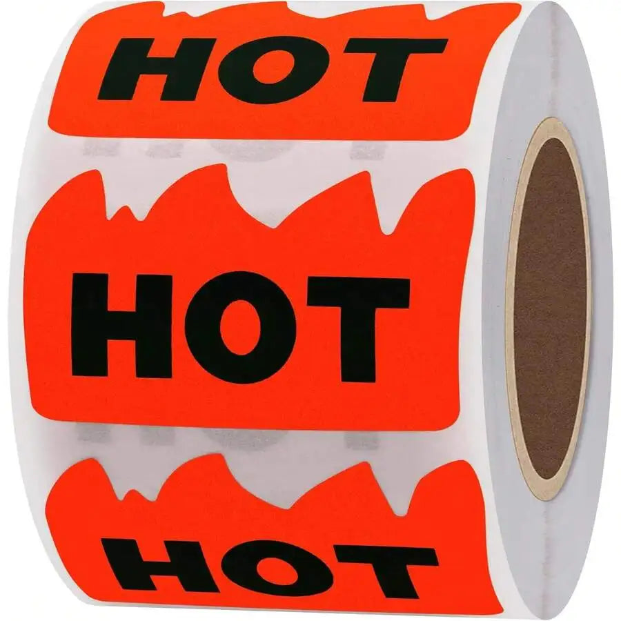 A roll of fluorescent red adhesive labels shaped like flames with the word HOT printed on them