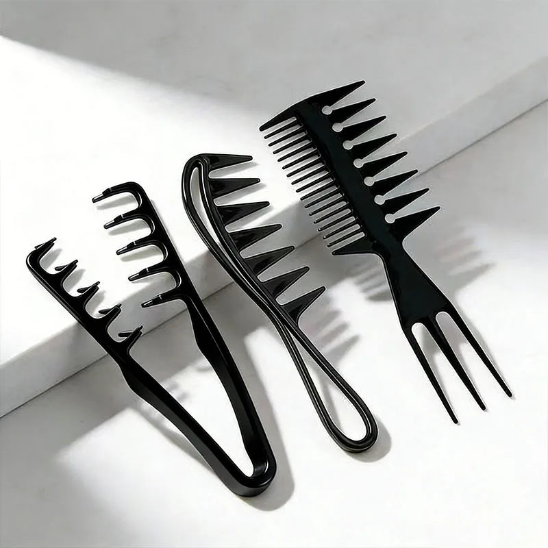 Three black plastic hair styling combs placed on a white marble surface