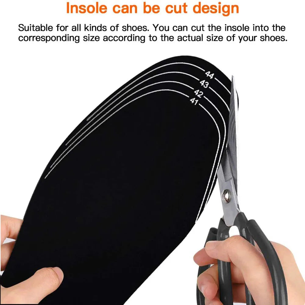 Person cutting an insole with scissors to customize the size