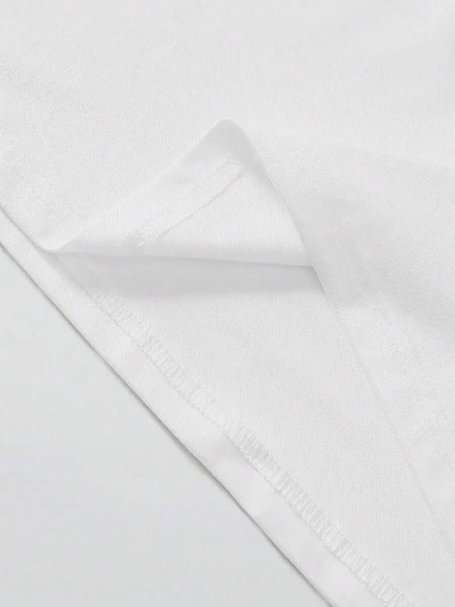 Close-up of white fabric texture showing short sleeve detail