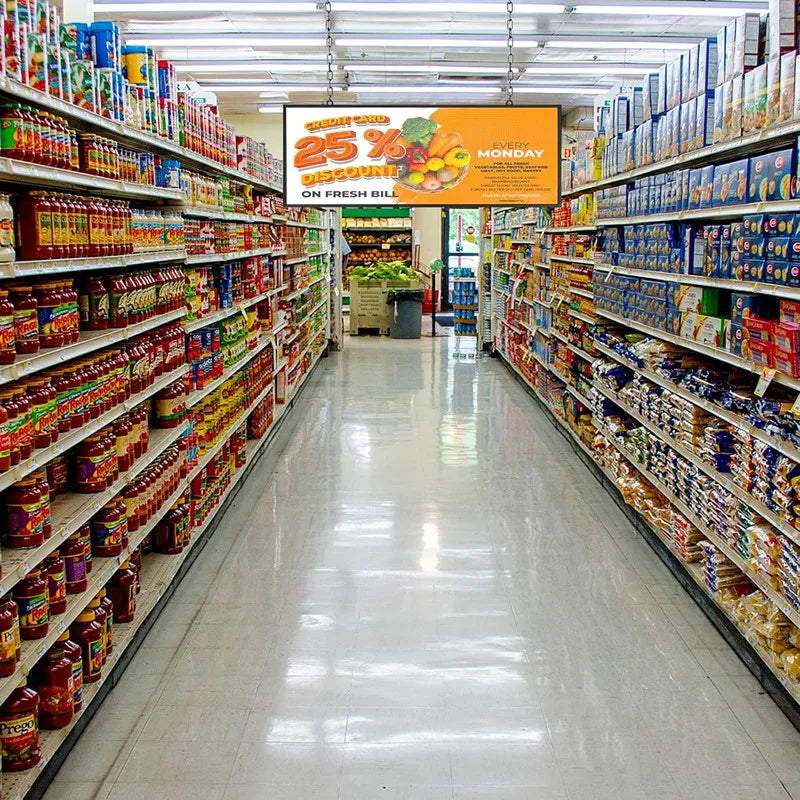 LED sign board hanging in a supermarket aisle displaying a grocery discount promotion.