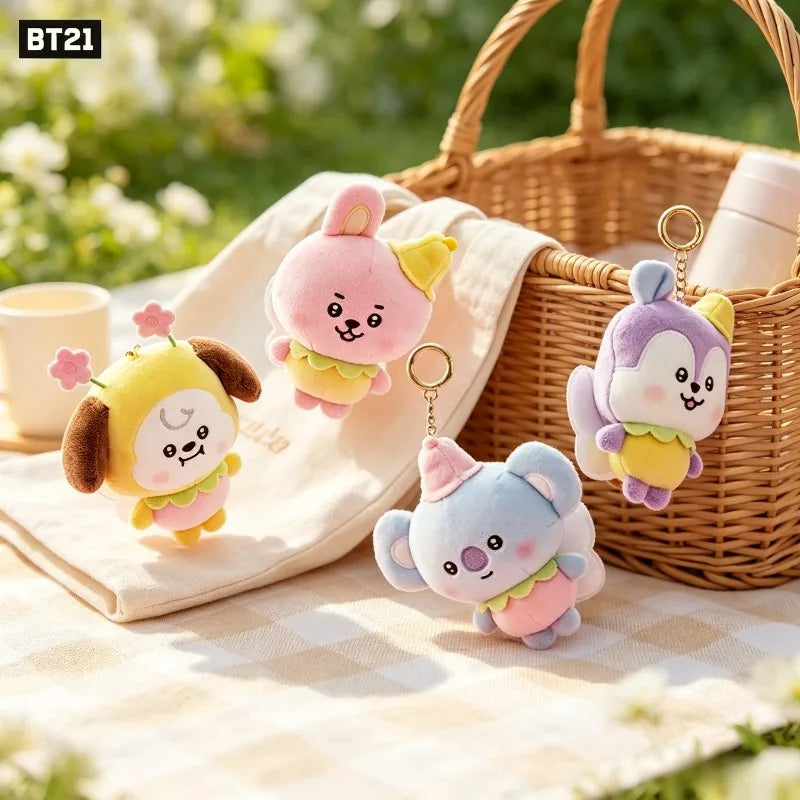 Assorted animal character plush keychains displayed in a picnic setting
