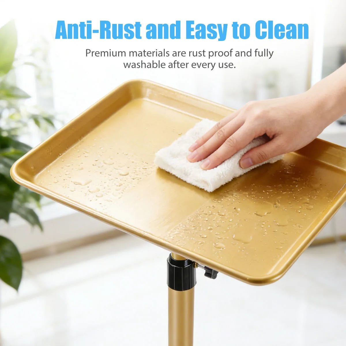 Hand cleaning a gold aluminum salon tray with a white cloth
