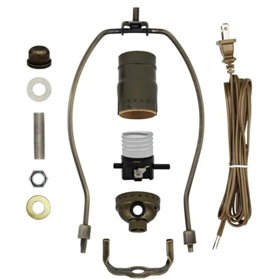 Antique brass finish lamp repair kit components including socket, harp, cord, and mounting hardware