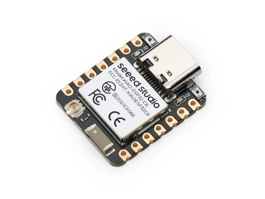 Top view of a small development board microcontroller with a metal shield and USB-C port