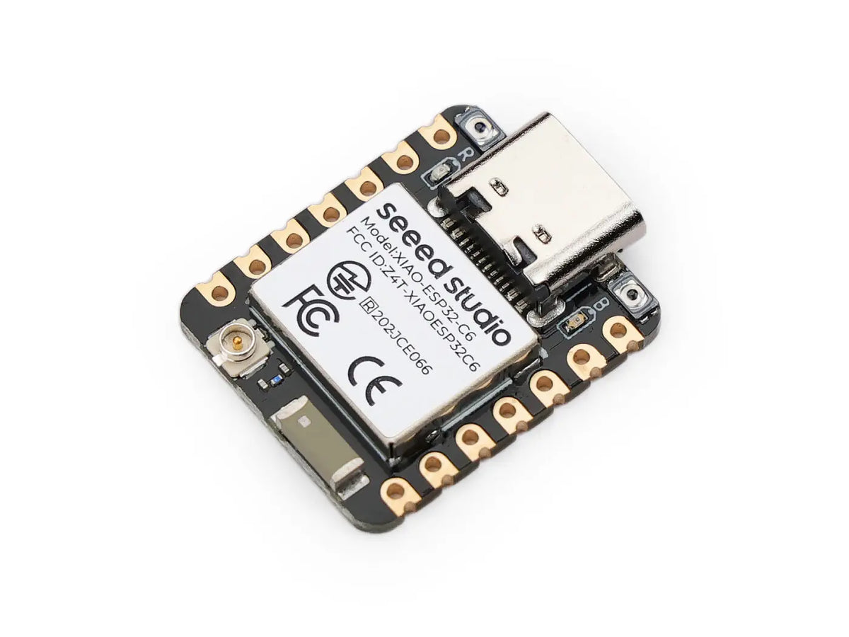 Top view of a small development board microcontroller with a metal shield and USB-C port