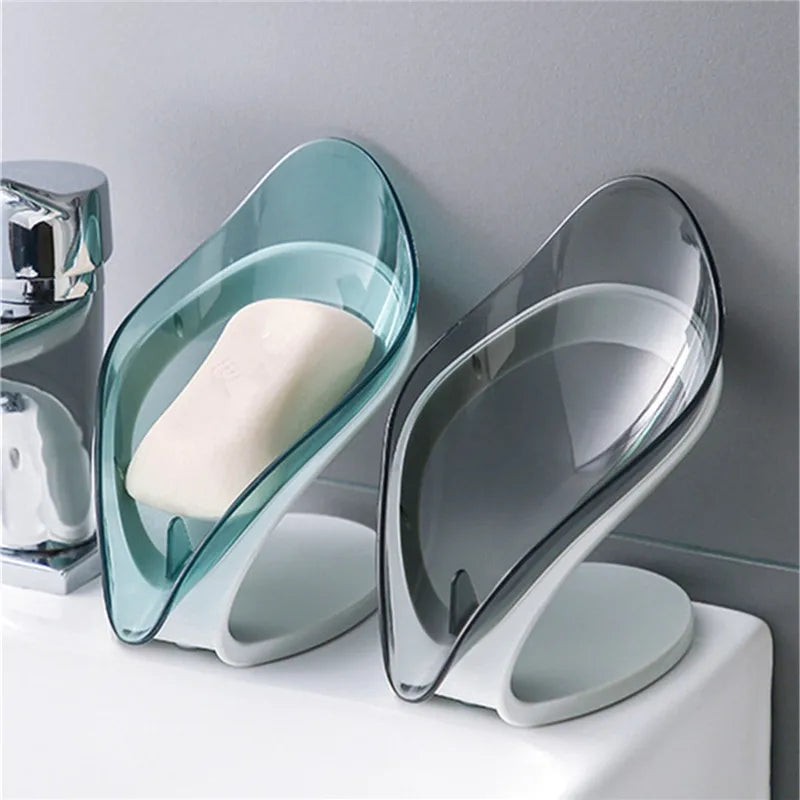Leaf-shaped blue and grey plastic soap dish with a suction cup base – view 2