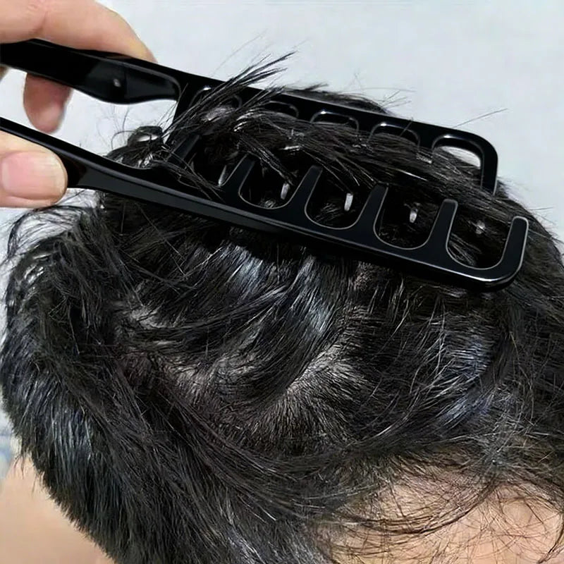 A close-up of a person using a black styling comb on their dark hair