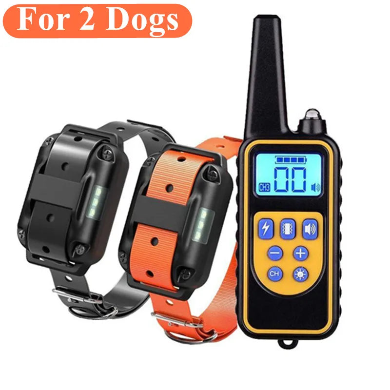 Handheld remote and two dog training collars in black and orange.