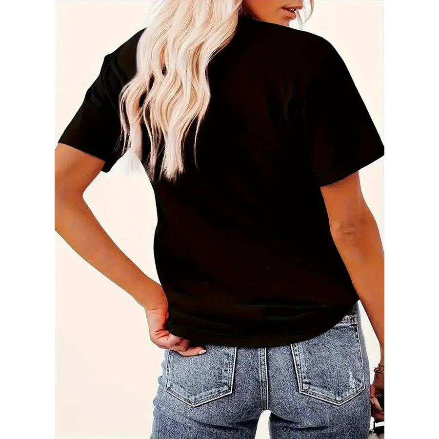 Back view of a woman wearing a black short sleeve t-shirt.