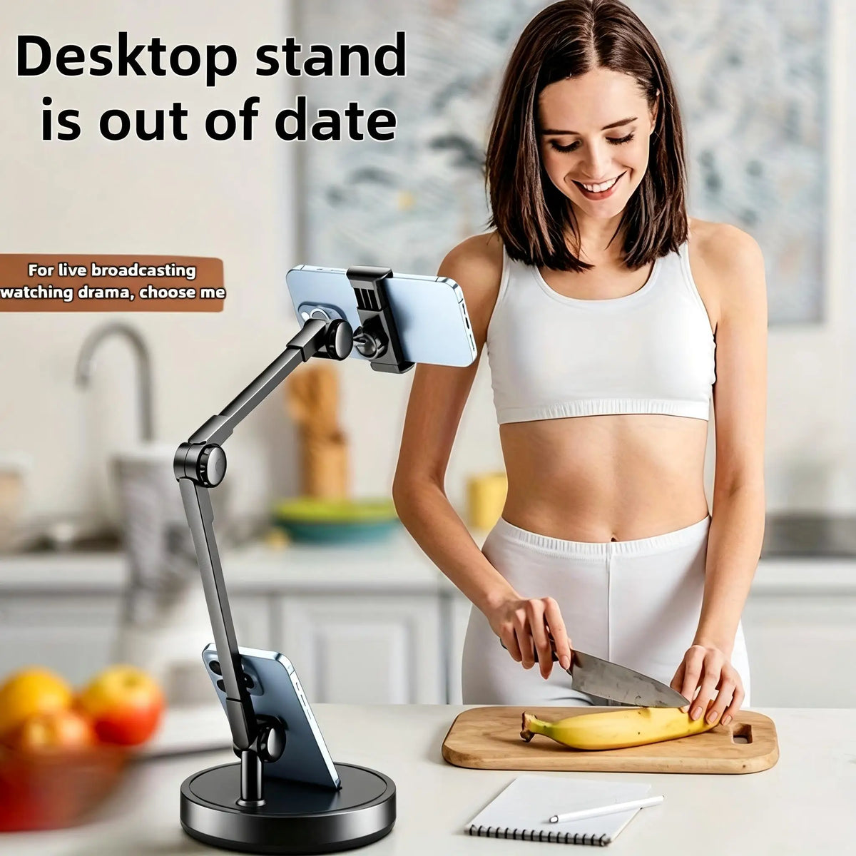 Adjustable black metal desk phone stand on a desk with a person preparing food in background