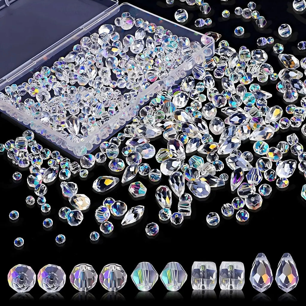 A variety of iridescent clear crystal beads in different shapes and sizes with a storage box.