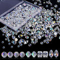 A variety of iridescent clear crystal beads in different shapes and sizes with a storage box.