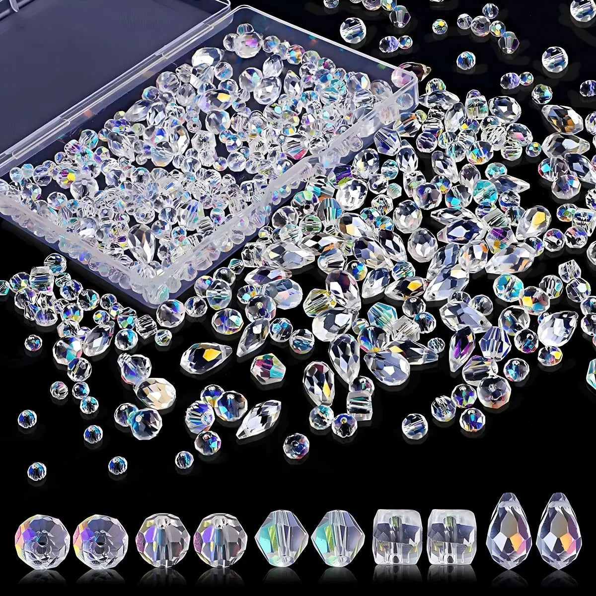 A variety of iridescent clear crystal beads in different shapes and sizes with a storage box.