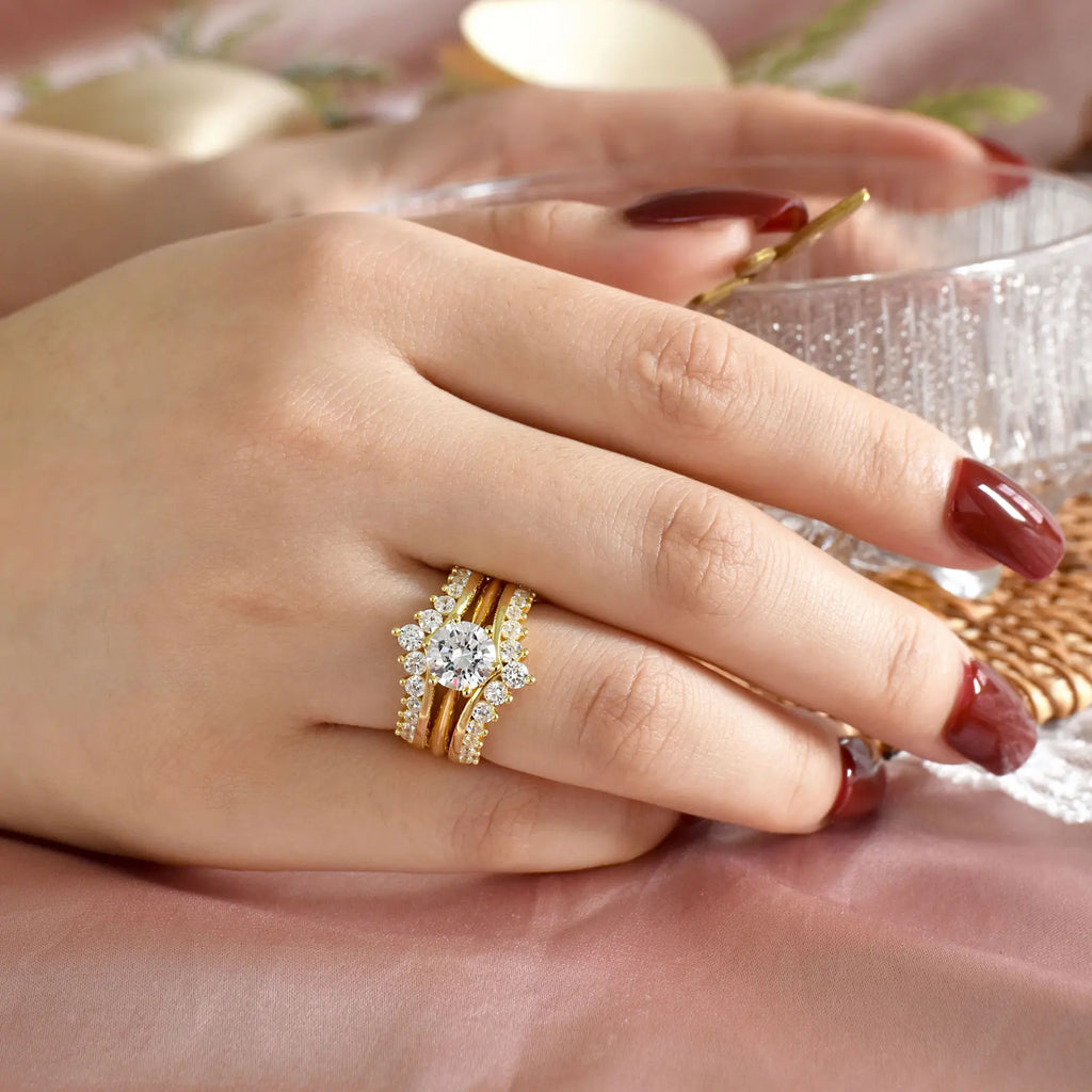 Woman wearing gold plated bridal ring set on her finger