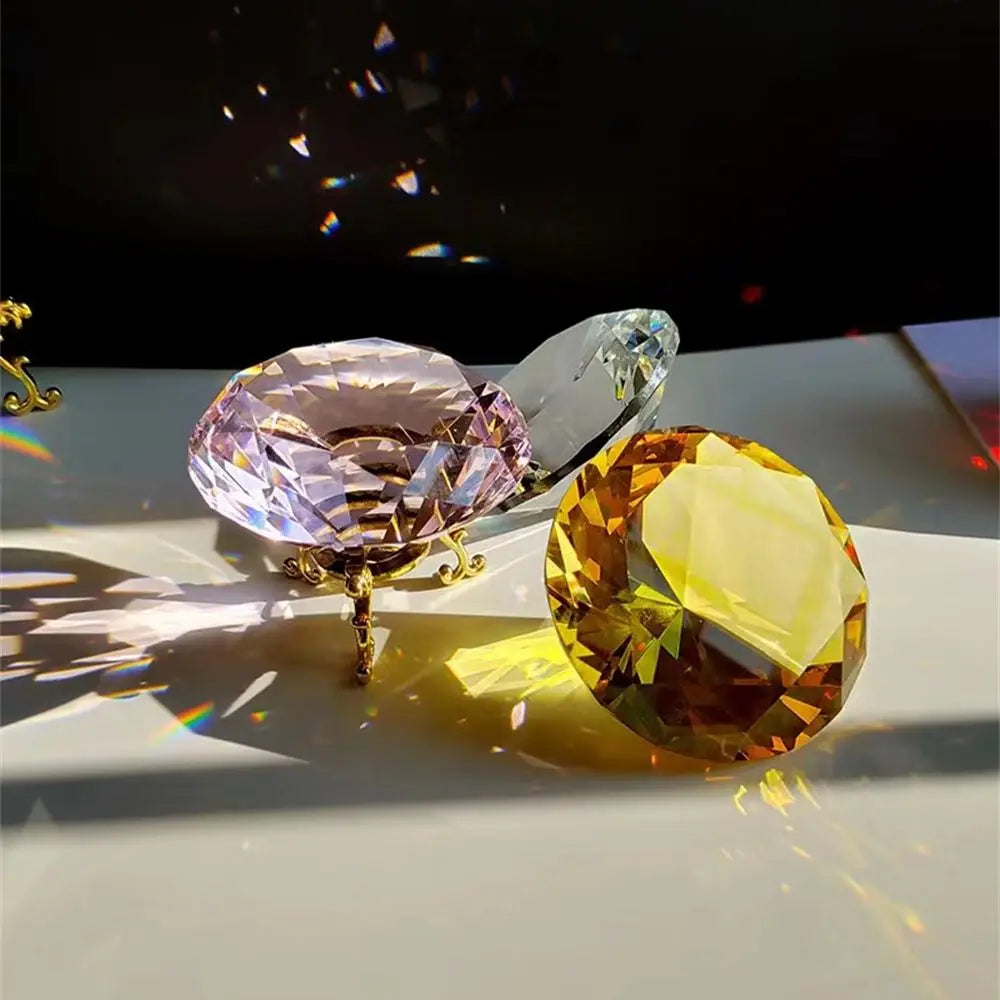 Yellow and light purple crystal diamond-shaped paperweights with light refractions