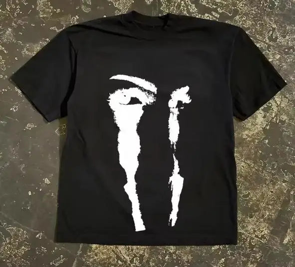 A loose fit short sleeve T-shirt with an American abstract eye face print pattern. – black