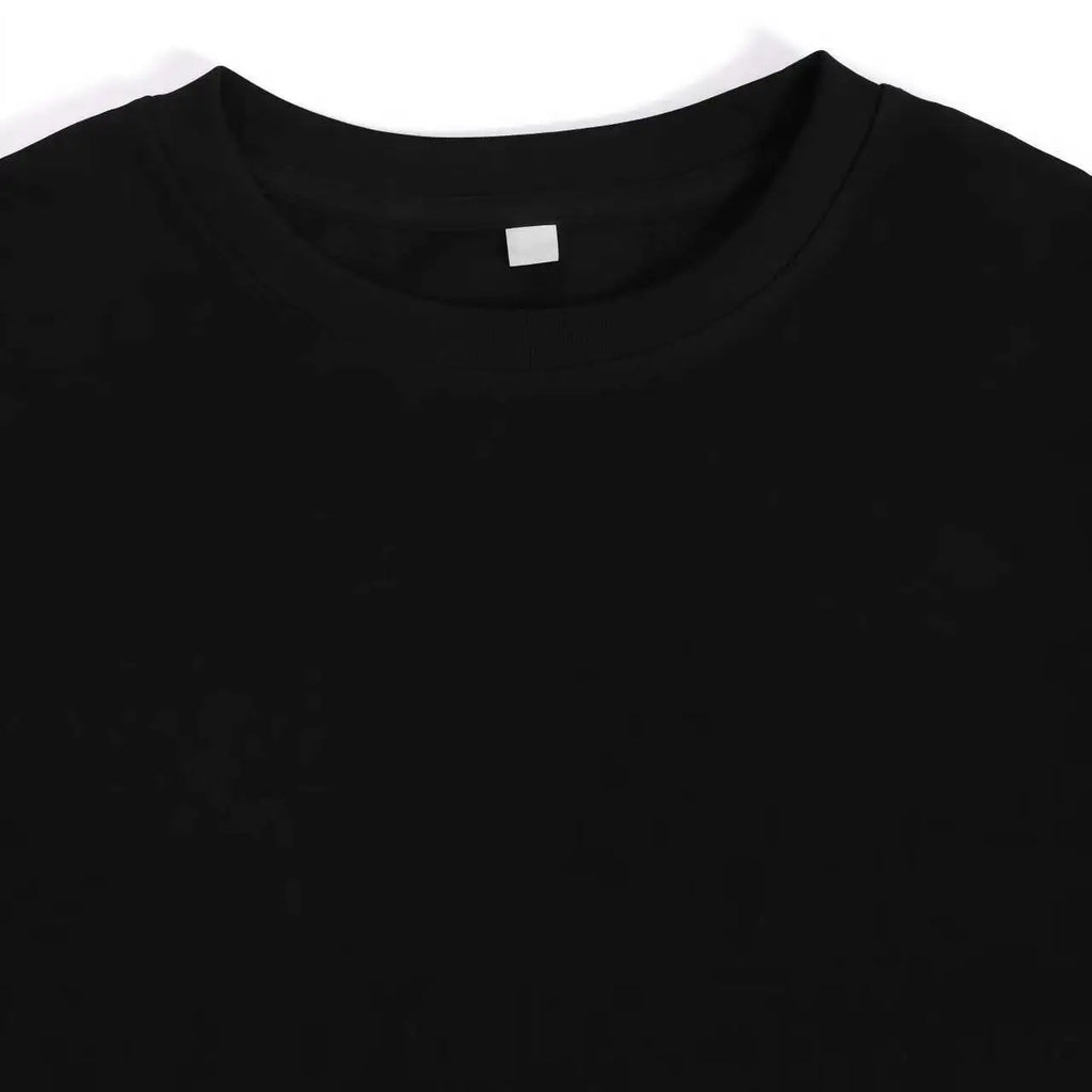 Close-up view of the collar area of a plain black t-shirt.