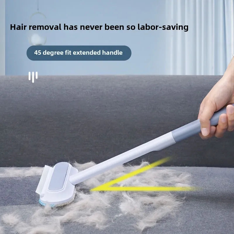 Person using a long-handle pet hair remover on a sofa to clean up cat hair