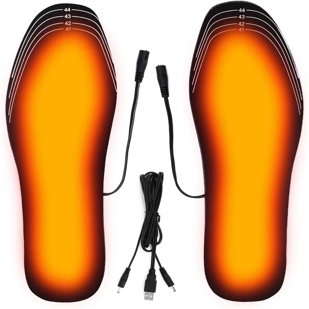 Pair of orange USB heated shoe insoles with visible electrical cord and plug