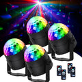 Four multicolored LED disco balls with remote controls and light beam background
