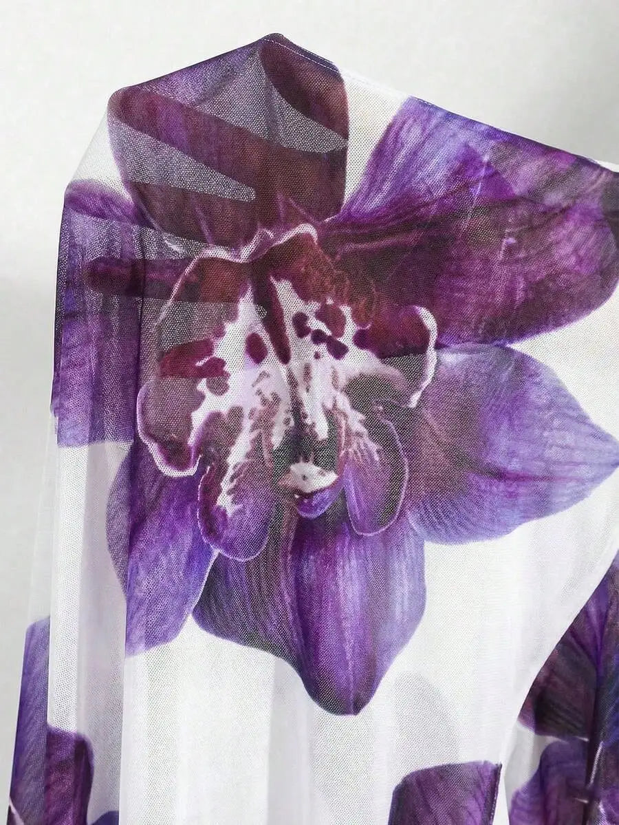 Close-up of a white fabric with purple floral print