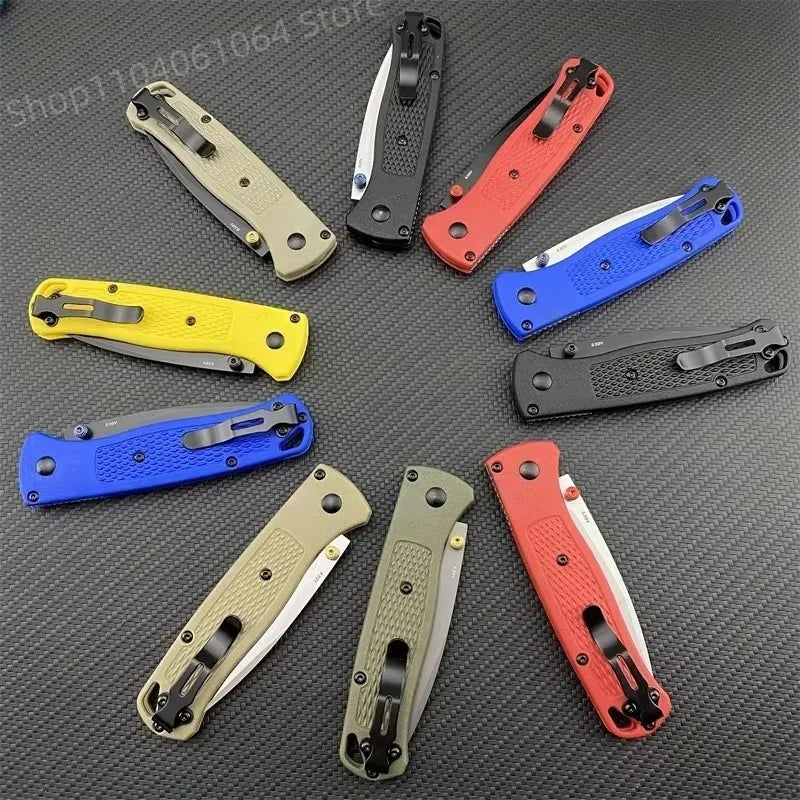 A collection of colorful folding pocket knives in different handle colors and blade finishes.