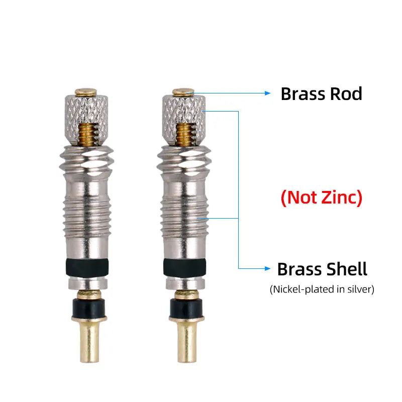 Two brass presta valve cores showing the rod and shell construction